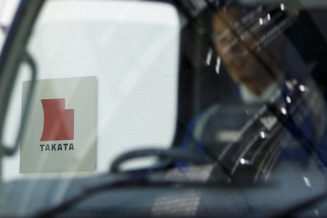 A logo of Takata Corp is seen through a car window outside the company's headquarter building in Tokyo April 12, 2013. REUTERS/Yuya Shino A logo of Takata Corp is seen through a car window outside the company's headquarter building in Tokyo April 12, 2013. REUTERS/Yuya Shino