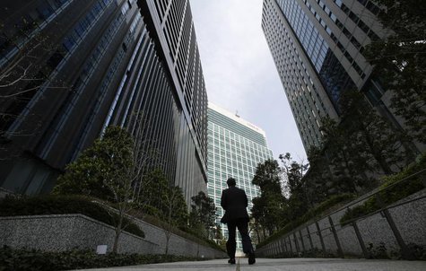 A businessman walks in Tokyo's business district April 1, 2013. REUTERS/Toru Hanai A businessman walks in Tokyo's business district April 1, 2013. REUTERS/Toru Hanai