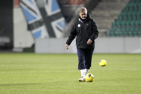 Estonia's national soccer team head coach Tarmo Ruutli plays with the ball as he attends a training session in Tallinn November 10, 2011. RE Estonia's national soccer team head coach Tarmo Ruutli plays with the ball as he attends a training session in Tallinn November 10, 2011. RE