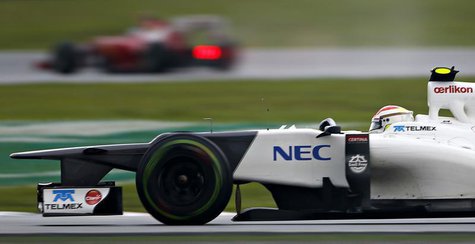 Sauber Formula One driver Sergio Perez of Mexico drives behind Ferrari Formula One driver Fernando Alonso of Spain during the Malaysian F1 G Sauber Formula One driver Sergio Perez of Mexico drives behind Ferrari Formula One driver Fernando Alonso of Spain during the Malaysian F1 G