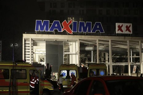 Ambulances are pictured parked near a store with a collapsed roof in Riga November 21, 2013. REUTERS/Ints Kalnins Ambulances are pictured parked near a store with a collapsed roof in Riga November 21, 2013. REUTERS/Ints Kalnins