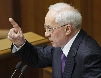 Ukraine's Prime Minister Mykola Azarov gestures during a session of the parliament in Kiev April 19, 2013. REUTERS/Gleb Garanich Ukraine's Prime Minister Mykola Azarov gestures during a session of the parliament in Kiev April 19, 2013. REUTERS/Gleb Garanich