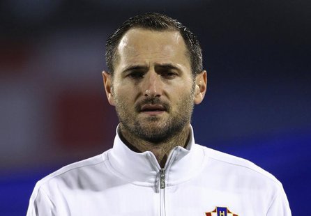 Croatia's Josip Simunic listens to the national anthem before their 2014 World Cup playoff soccer match against Iceland in Zagreb November 1 Croatia's Josip Simunic listens to the national anthem before their 2014 World Cup playoff soccer match against Iceland in Zagreb November 1