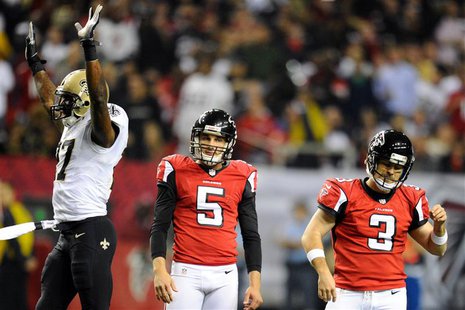 Nov 21, 2013; Atlanta, GA, USA; New Orleans Saints safety Malcolm Jenkins (27) and Atlanta Falcons punter Matt Bosher (5) and place kicker M Nov 21, 2013; Atlanta, GA, USA; New Orleans Saints safety Malcolm Jenkins (27) and Atlanta Falcons punter Matt Bosher (5) and place kicker M