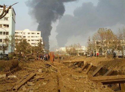 Smoke rises after a pipeline explosion in Huangdao, Qingdao, Shandong Province November 22, 2013. REUTERS/China Daily Smoke rises after a pipeline explosion in Huangdao, Qingdao, Shandong Province November 22, 2013. REUTERS/China Daily