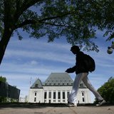 A woman walks past the Supreme Court of Canada in Ottawa May 7, 2010. REUTERS/Chris Wattie A woman walks past the Supreme Court of Canada in Ottawa May 7, 2010. REUTERS/Chris Wattie