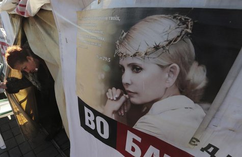A woman walks out from a tent at a protest camp set up by supporters of jailed former Ukrainian Prime Minister and opposition leader Yulia T A woman walks out from a tent at a protest camp set up by supporters of jailed former Ukrainian Prime Minister and opposition leader Yulia T