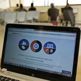 A busy screen is shown on the laptop of a Certified Application Counselor as he attempted to enroll an interested person for Affordable Care A busy screen is shown on the laptop of a Certified Application Counselor as he attempted to enroll an interested person for Affordable Care