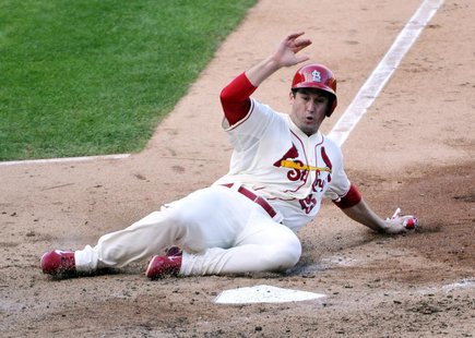 Oct 12, 2013; St. Louis, MO, USA; St. Louis Cardinals third baseman David Freese (23) scores a run against the Los Angeles Dodgers during th Oct 12, 2013; St. Louis, MO, USA; St. Louis Cardinals third baseman David Freese (23) scores a run against the Los Angeles Dodgers during th