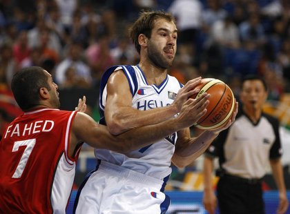 Greece's Vassilis Spanoulis (R) is challenged by Lebanon's Rony Fahed during their basketball game at FIBA Olympic qualifying tournament in Greece's Vassilis Spanoulis (R) is challenged by Lebanon's Rony Fahed during their basketball game at FIBA Olympic qualifying tournament in