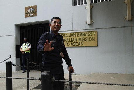 A security personnel raises his hand in an attempt to stop the media from taking pictures in front of the Australian Embassy gate in Jakarta A security personnel raises his hand in an attempt to stop the media from taking pictures in front of the Australian Embassy gate in Jakarta