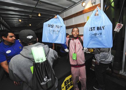 A Xbox fan celebrates after receiving his new Xbox One after midnight during the Xbox One fan celebration and launch party in Los Angeles, C A Xbox fan celebrates after receiving his new Xbox One after midnight during the Xbox One fan celebration and launch party in Los Angeles, C
