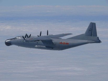 A Chinese military plane Y-8 airborne early warning plane flies through airspace between Okinawa prefecture's main island and the smaller Mi A Chinese military plane Y-8 airborne early warning plane flies through airspace between Okinawa prefecture's main island and the smaller Mi