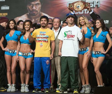 Brandon Rios (2nd R) of the U.S. and Manny Pacquiao (front, 3rd L) of the Philippines pose after an official weigh-in for their World Boxing Brandon Rios (2nd R) of the U.S. and Manny Pacquiao (front, 3rd L) of the Philippines pose after an official weigh-in for their World Boxing