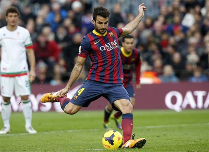 Barcelona's Cesc Fabregas scores from a penalty during their Spanish First division soccer match against Granada at Camp Nou stadium in Barc Barcelona's Cesc Fabregas scores from a penalty during their Spanish First division soccer match against Granada at Camp Nou stadium in Barc