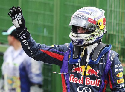 Red Bull Formula One driver Sebastian Vettel of Germany celebrates after taking pole position at the qualifying session of the Brazilian F1 Red Bull Formula One driver Sebastian Vettel of Germany celebrates after taking pole position at the qualifying session of the Brazilian F1