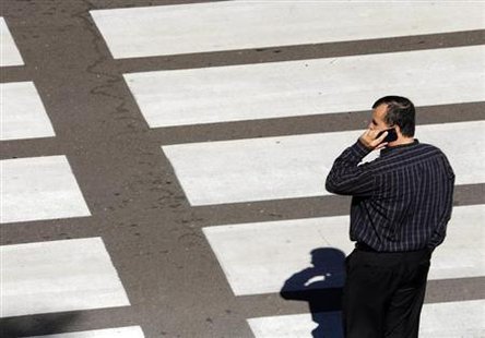 A man talks on his mobile phone as he waits at a crosswalk at Lindbergh Field Airport in San Diego, California, November 6, 2013.
Credit: Reuters/Mike Blake
A man talks on his mobile phone as he waits at a crosswalk at Lindbergh Field Airport in San Diego, California, November 6, 2013.
Credit: Reuters/Mike Blake