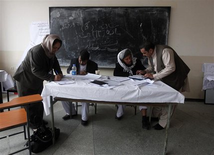 Members of the Loya Jirga, or grand council, take part in a committee session in Kabul November 23, 2013. REUTERS/Mohammad Ismail Members of the Loya Jirga, or grand council, take part in a committee session in Kabul November 23, 2013. REUTERS/Mohammad Ismail