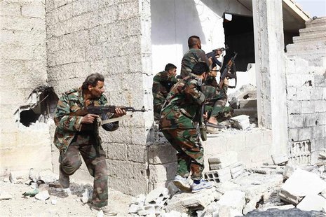 Shi'ite fighters, who support Syrian President Bashar al-Assad, search for rebels from house to house in the countryside near Damascus Novem Shi'ite fighters, who support Syrian President Bashar al-Assad, search for rebels from house to house in the countryside near Damascus Novem