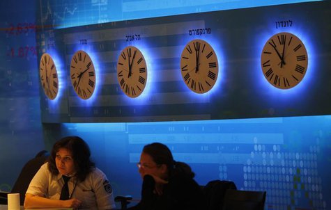 Workers sit inside the Tel Aviv stock exchange November 25, 2008. REUTERS/Gil Cohen Magen Workers sit inside the Tel Aviv stock exchange November 25, 2008. REUTERS/Gil Cohen Magen
