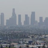 The skyline of downtown Los Angeles through a layer of smog is seen in the distance from a rooftop in Hollywood, California, May 31, 2006. R The skyline of downtown Los Angeles through a layer of smog is seen in the distance from a rooftop in Hollywood, California, May 31, 2006. R