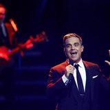 British singer Robbie Williams performs during the Bambi 2013 media awards ceremony in Berlin November 14, 2013. REUTERS/Tobias Schwarz British singer Robbie Williams performs during the Bambi 2013 media awards ceremony in Berlin November 14, 2013. REUTERS/Tobias Schwarz