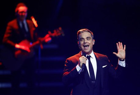 British singer Robbie Williams performs during the Bambi 2013 media awards ceremony in Berlin November 14, 2013. REUTERS/Tobias Schwarz British singer Robbie Williams performs during the Bambi 2013 media awards ceremony in Berlin November 14, 2013. REUTERS/Tobias Schwarz