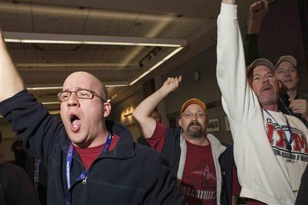 Union members celebrate after hearing the results of a union vote at the International Association of Machinists District 751 Headquarters in Seattle, Washington November 13, 2013.
CREDIT: REUTERS/DAVID RYDER Union members celebrate after hearing the results of a union vote at the International Association of Machinists District 751 Headquarters in Seattle, Washington November 13, 2013.
CREDIT: REUTERS/DAVID RYDER