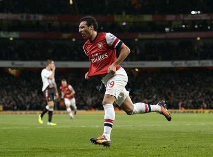 Arsenal's Santi Cazorla celebrates after scoring a goal against Liverpool during their English Premier League soccer match at the Emirates s Arsenal's Santi Cazorla celebrates after scoring a goal against Liverpool during their English Premier League soccer match at the Emirates s