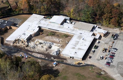 Demolition work is underway at Sandy Hook Elementary School in Newtown, Connecticut October 25, 2013. REUTERS/Michelle McLoughlin Demolition work is underway at Sandy Hook Elementary School in Newtown, Connecticut October 25, 2013. REUTERS/Michelle McLoughlin