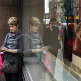 A woman stops to use her phone in front of holiday window displays at Macy's flagship store in New York, November 22, 2013. REUTERS/Lucas Ja A woman stops to use her phone in front of holiday window displays at Macy's flagship store in New York, November 22, 2013. REUTERS/Lucas Ja