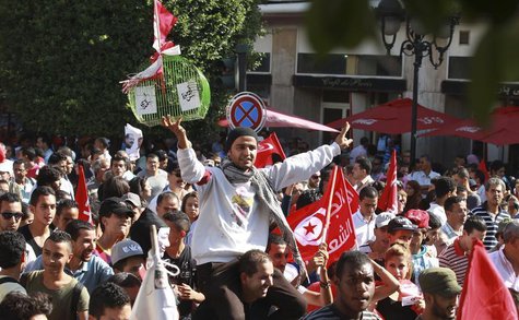 Protesters shout slogans during a demonstration to call for the departure of the Islamist-led ruling coalition in Avenue Habib-Bourguiba in Protesters shout slogans during a demonstration to call for the departure of the Islamist-led ruling coalition in Avenue Habib-Bourguiba in