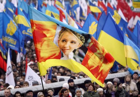 A flag with an image of Yulia Tymoshenko is carried by protesters attending a rally to support EU integration in central Kiev November 24, 2 A flag with an image of Yulia Tymoshenko is carried by protesters attending a rally to support EU integration in central Kiev November 24, 2