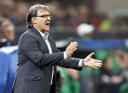 Barcelona's coach Gerardo Martino reacts during their Champions League soccer match against AC Milan at the San Siro stadium in Milan, Octob Barcelona's coach Gerardo Martino reacts during their Champions League soccer match against AC Milan at the San Siro stadium in Milan, Octob
