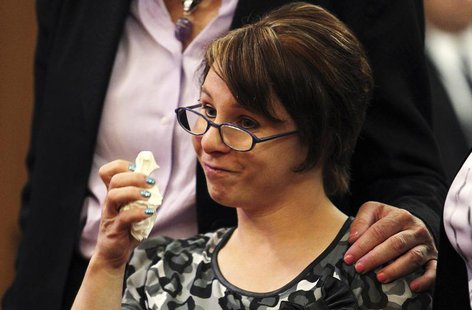 Michelle Knight, one of the three kidnapped women, pauses to wipe away tears as she reads her statements during the sentencing of her accuse Michelle Knight, one of the three kidnapped women, pauses to wipe away tears as she reads her statements during the sentencing of her accuse