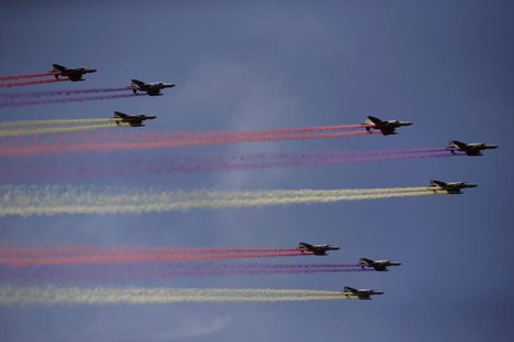 Coloured contrails are seen behind South Korean Air Force F-16 fighter jets in the sky during celebrations to mark the 65th anniversary of K Coloured contrails are seen behind South Korean Air Force F-16 fighter jets in the sky during celebrations to mark the 65th anniversary of K
