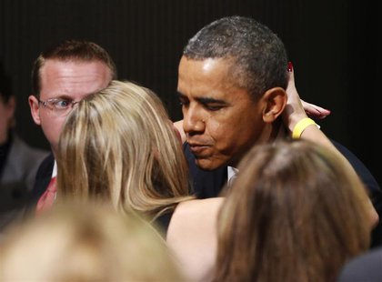 U.S. President Barack Obama kisses a member of the audience as he participates in a Democratic Party fundraiser in San Francisco November 25 U.S. President Barack Obama kisses a member of the audience as he participates in a Democratic Party fundraiser in San Francisco November 25