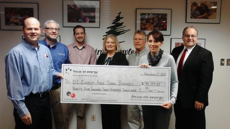DC Everest officials get a check from WPS and Focus on Energy for new energy saving equipment in the district, November 22 2013 DC Everest officials get a check from WPS and Focus on Energy for new energy saving equipment in the district, November 22 2013