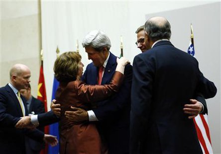 U.S. Secretary of State John Kerry (3rd R) hugs European Union foreign policy chief Catherine Ashton after she delivered a statement during a ceremony next to British Foreign Secretary William Hague (L), Germany's Foreign Minister Guido Westerwelle (R) and French Foreign Affairs Minister Laurent Fabius at the United Nations in Geneva November 24, 2013.
Credit: Reuters/Denis Balibouse U.S. Secretary of State John Kerry (3rd R) hugs European Union foreign policy chief Catherine Ashton after she delivered a statement during a ceremony next to British Foreign Secretary William Hague (L), Germany's Foreign Minister Guido Westerwelle (R) and French Foreign Affairs Minister Laurent Fabius at the United Nations in Geneva November 24, 2013.
Credit: Reuters/Denis Balibouse
