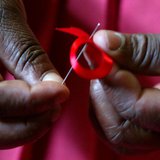 A Kenyan woman prepares ribbons ahead of December 1st, the World Aids Day at Beacon of Hope centre in Nairobi. REUTERS/Antony Njuguna A Kenyan woman prepares ribbons ahead of December 1st, the World Aids Day at Beacon of Hope centre in Nairobi. REUTERS/Antony Njuguna