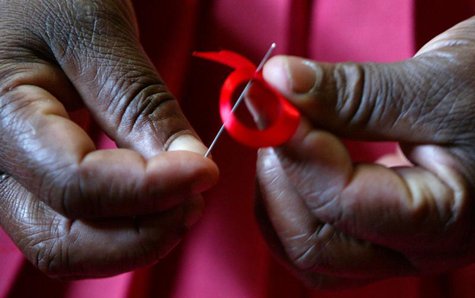 A Kenyan woman prepares ribbons ahead of December 1st, the World Aids Day at Beacon of Hope centre in Nairobi. REUTERS/Antony Njuguna A Kenyan woman prepares ribbons ahead of December 1st, the World Aids Day at Beacon of Hope centre in Nairobi. REUTERS/Antony Njuguna