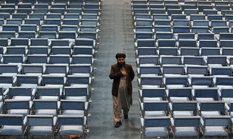 A member of the Loya Jirga, grand council, leaves on the last day of the Loya Jirga, in Kabul November 24, 2013. REUTERS/Omar Sobhani A member of the Loya Jirga, grand council, leaves on the last day of the Loya Jirga, in Kabul November 24, 2013. REUTERS/Omar Sobhani