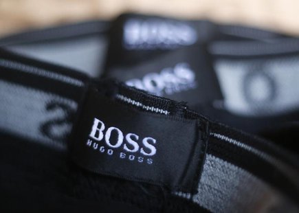 The logo of German fashion house Hugo Boss is seen on a clothing label at their outlet store in Mezingen near Stuttgart October 29, 2013. RE The logo of German fashion house Hugo Boss is seen on a clothing label at their outlet store in Mezingen near Stuttgart October 29, 2013. RE