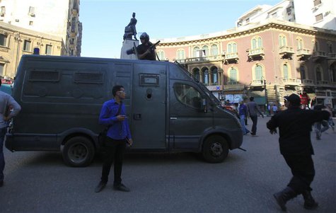 Riot police take position during a protest against a new law in Egypt that restricts demonstrations, in downtown Cairo November 26, 2013. RE Riot police take position during a protest against a new law in Egypt that restricts demonstrations, in downtown Cairo November 26, 2013. RE