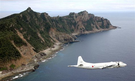 Japan Maritime Self-Defense Force's PC3 surveillance plane flies around the disputed islands in the East China Sea, known as the Senkaku isl Japan Maritime Self-Defense Force's PC3 surveillance plane flies around the disputed islands in the East China Sea, known as the Senkaku isl