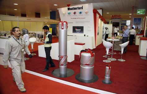 A security personnel walks past the Weatherford booth during the Basra International trade fair for oil and gas in Basra, 420 km (260 miles) A security personnel walks past the Weatherford booth during the Basra International trade fair for oil and gas in Basra, 420 km (260 miles)