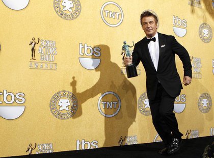 Actor Alec Baldwin runs backstage with his award for outstanding performance by a male actor in a comedy series for "30 Rock", at the 18th a Actor Alec Baldwin runs backstage with his award for outstanding performance by a male actor in a comedy series for "30 Rock", at the 18th a
