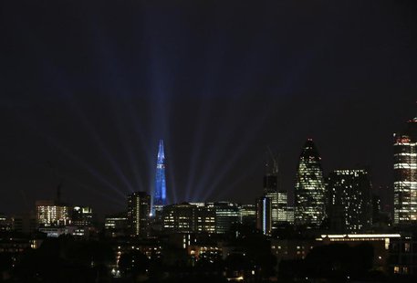 A laser and searchlight show marks the completion of the exterior of the Shard building in central London July 5, 2012. REUTERS/Olivia Harri A laser and searchlight show marks the completion of the exterior of the Shard building in central London July 5, 2012. REUTERS/Olivia Harri