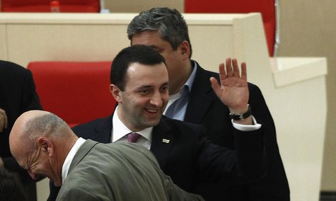 Georgia's Prime Minister Irakly Garibashvili (C) waves as he is congratulated by members of parliament during a session in parliament in Kut Georgia's Prime Minister Irakly Garibashvili (C) waves as he is congratulated by members of parliament during a session in parliament in Kut