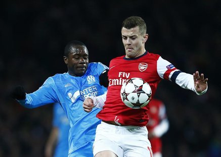 Arsenal's Jack Wilshere (R) challenges Olympique Marseille's Giannelli Imbula during their Champions League soccer match at the Emirates sta Arsenal's Jack Wilshere (R) challenges Olympique Marseille's Giannelli Imbula during their Champions League soccer match at the Emirates sta